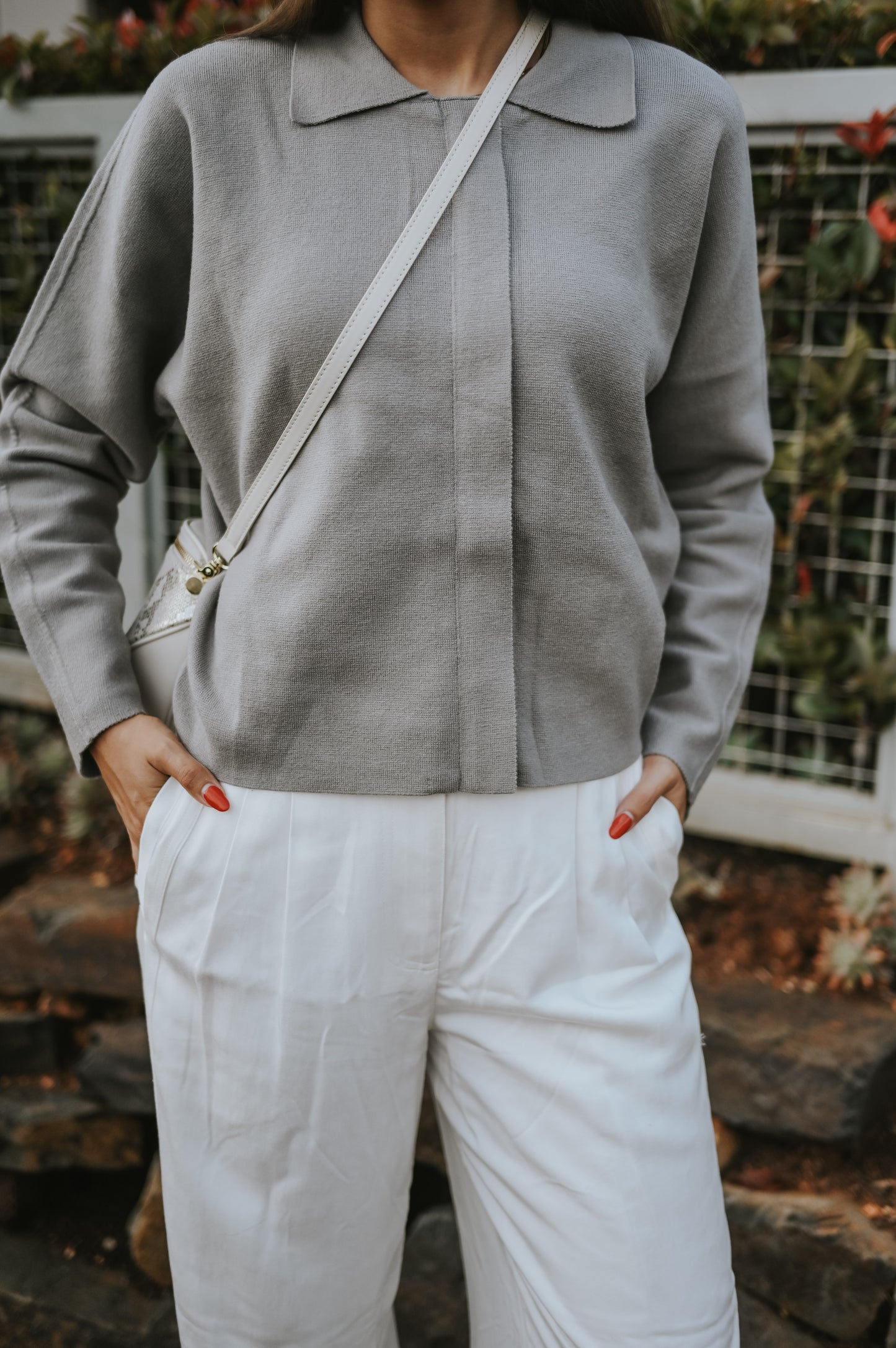 Light grey cardigan with long sleeves and hidden zipper
