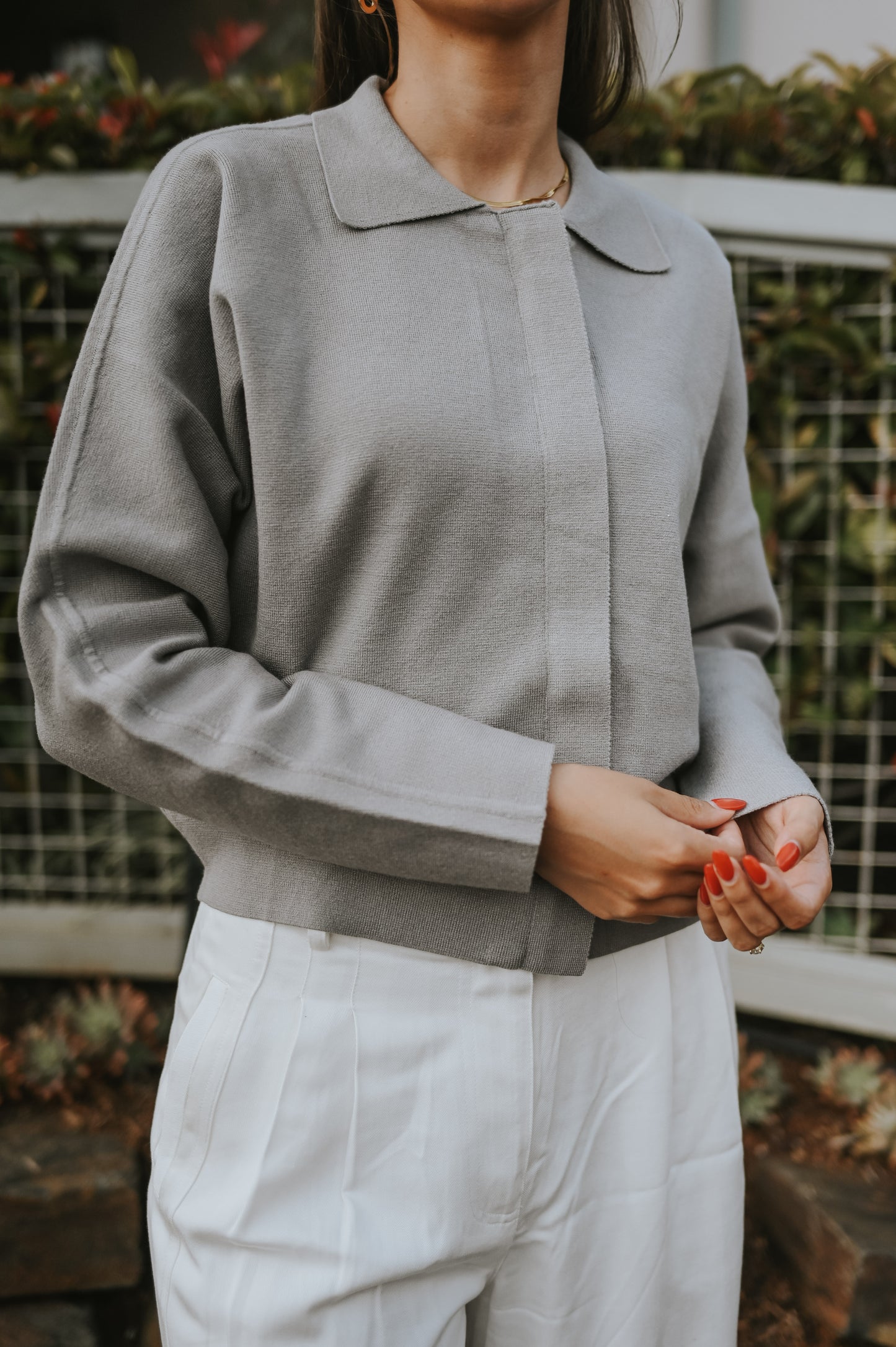 Light grey cardigan with long sleeves and hidden zipper